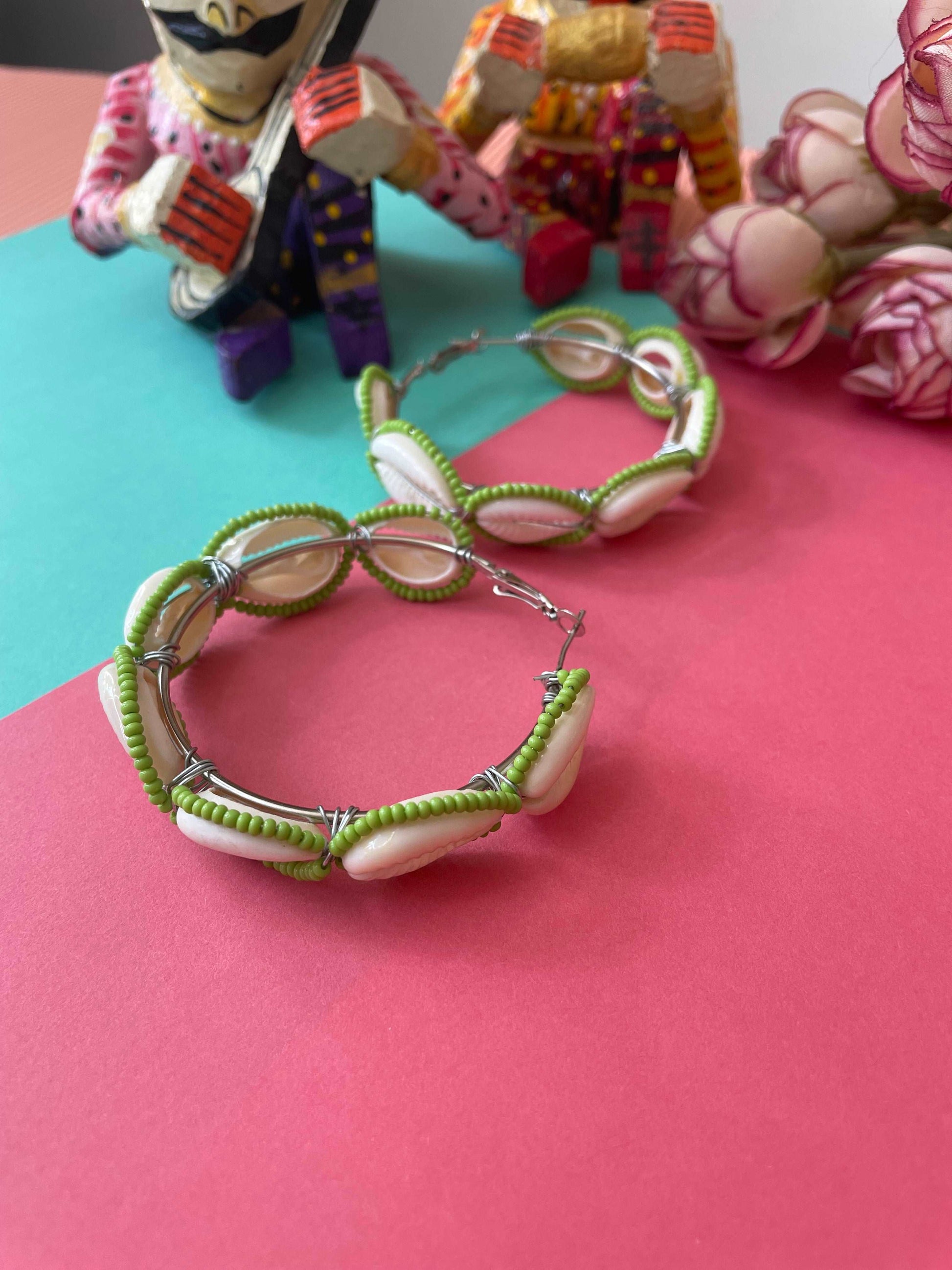 Green beaded shell hoops