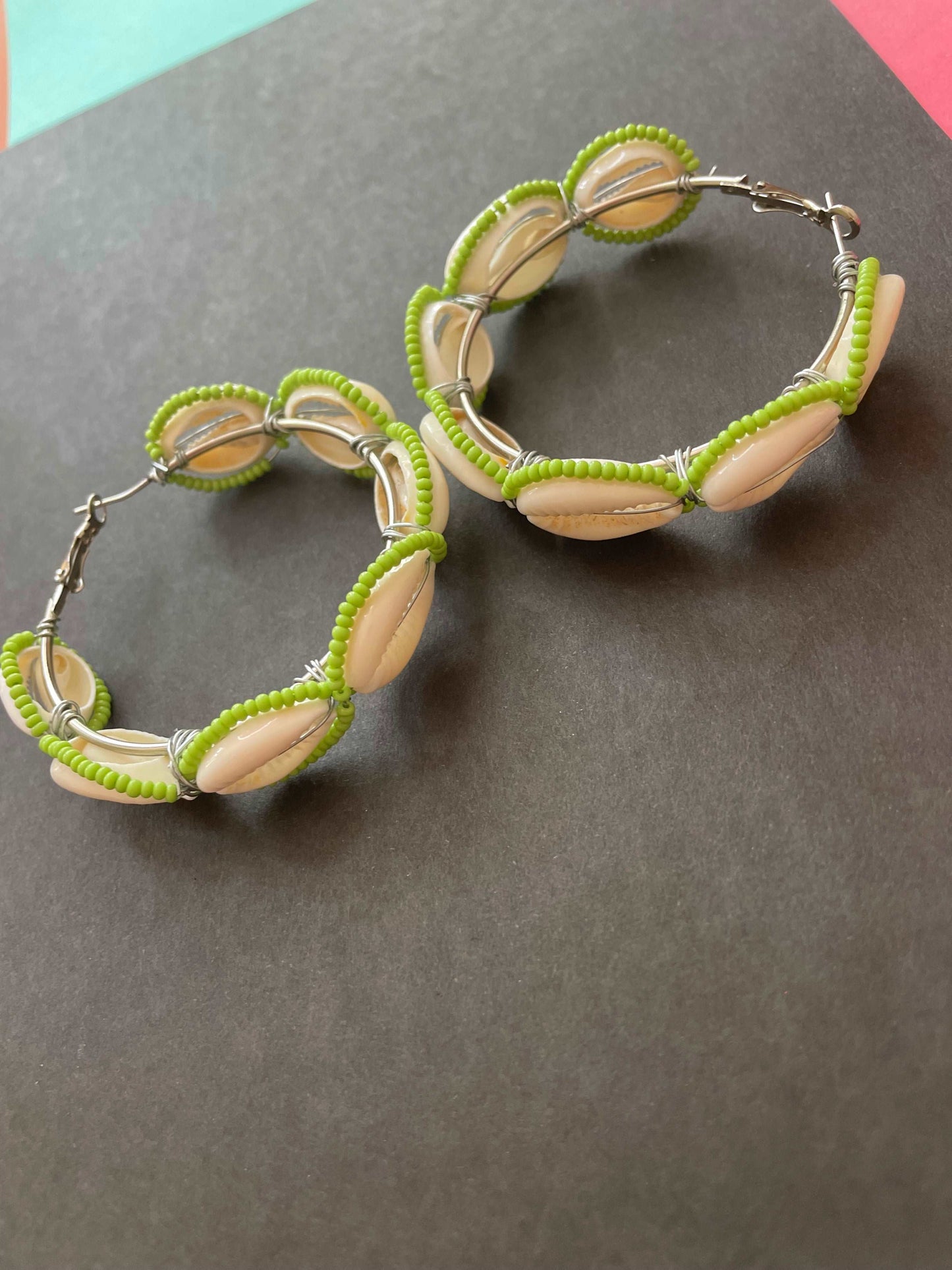 Green beaded shell hoops