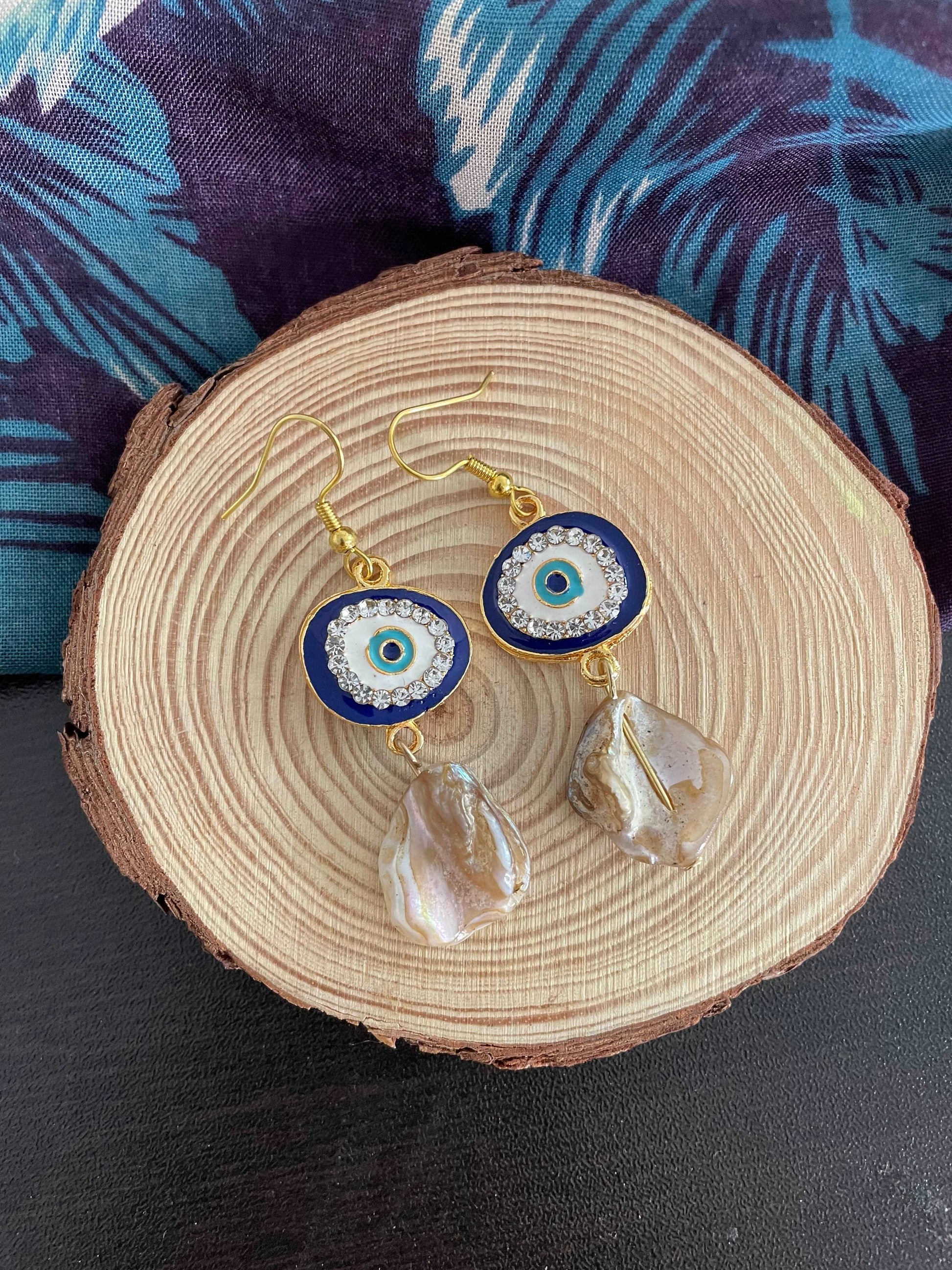 Evil eye and mother of pearl dangler