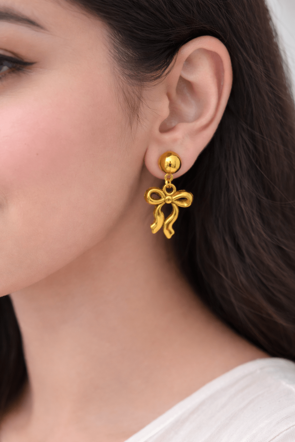 Golden bow earrings - Kalakari